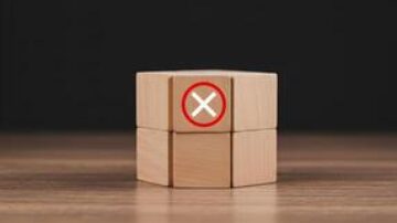 71523067-de-madeira-blocos-com-uma-vermelho-circulado-x-simbolo-significando-rejeicao-negacao-cancelamento-ou-erro-em-uma-de-madeira-mesa-contra-uma-sombrio-fundo-foto